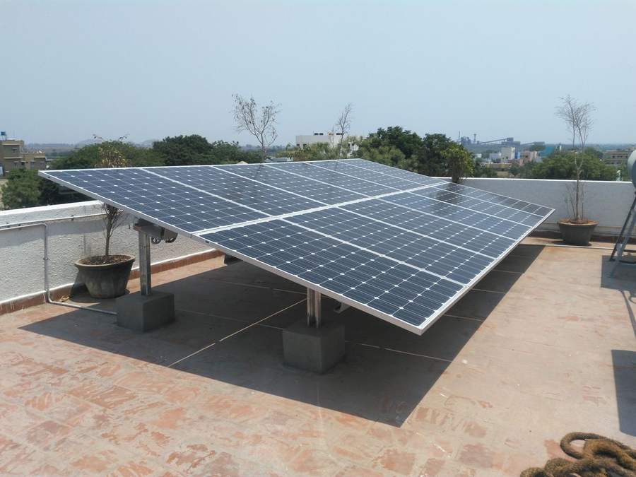 Ground-mounted rooftop solar panel array installed for a small business